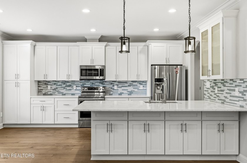Welcome home to this beautifully crafted custom residence where - photo 9