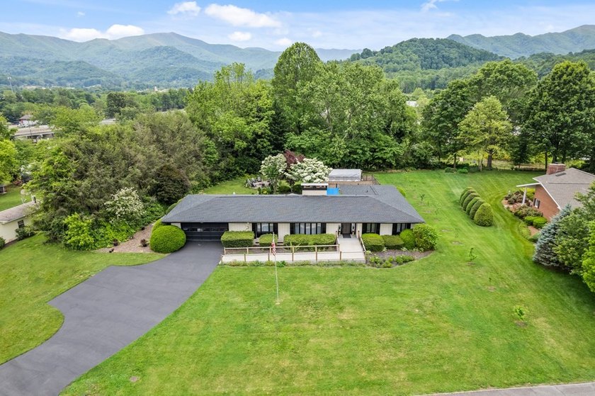 Experience elevated mountain living with the rare combination of - photo 4