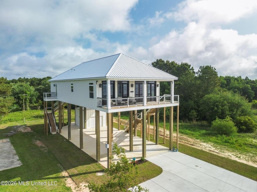 Experience effortless beachfront living in this stunning turnkey - photo 2
