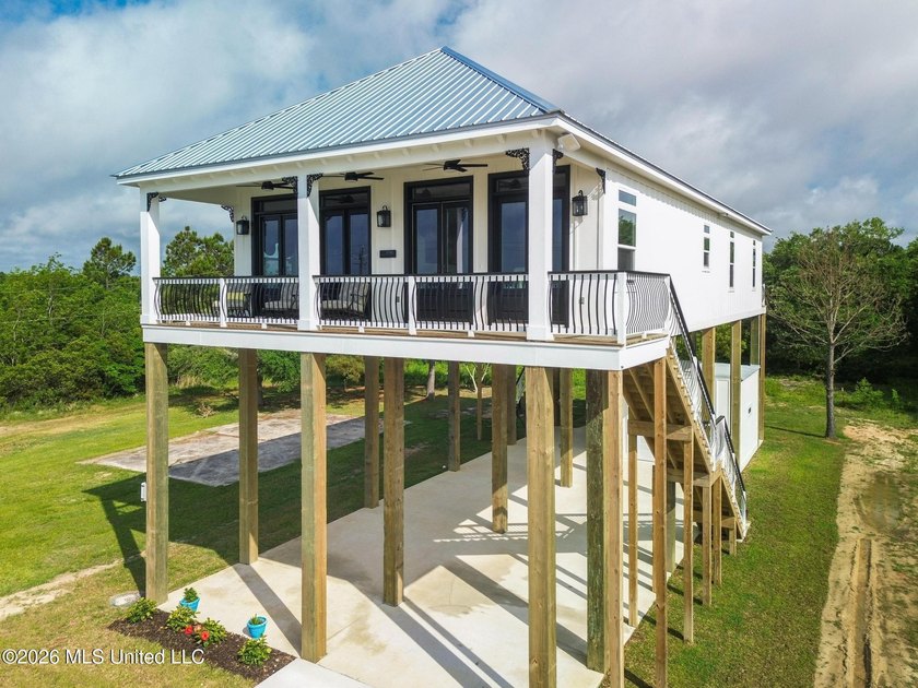 Experience effortless beachfront living in this stunning turnkey - photo 3