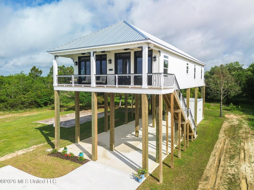 Experience effortless beachfront living in this stunning turnkey - photo 4
