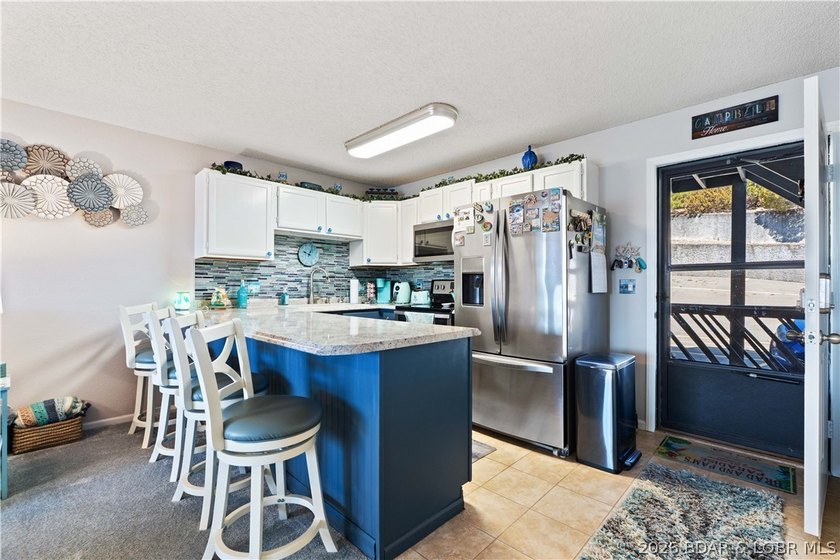 Motivated sellers! Experience the ultimate lakefront lifestyle - photo 11