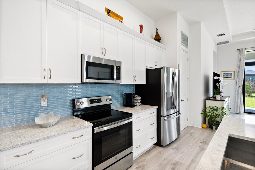 Welcome to luxury living in PGA Verano! This 2024 Alison model - photo 11
