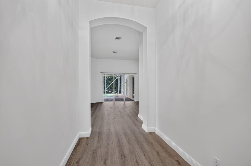 Welcome to this pristine, single-story pool home zoned for - photo 7