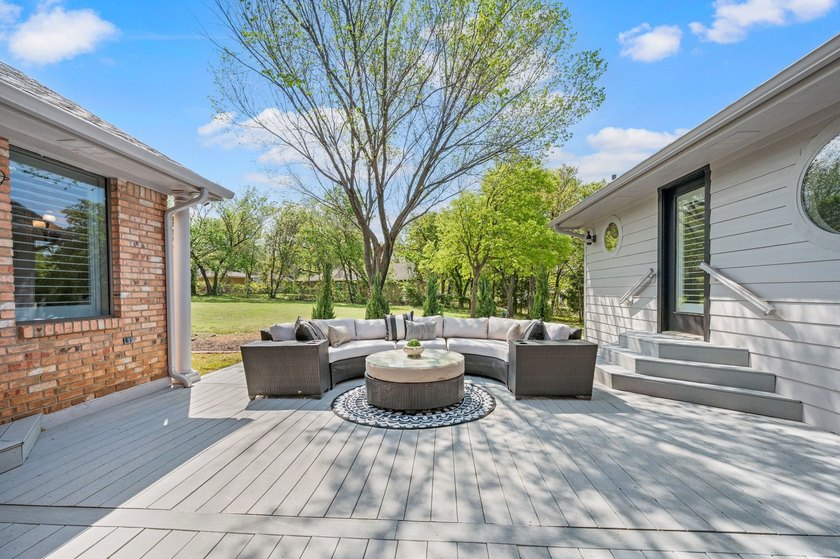 Set beneath a canopy of mature trees, there is an ease to this - photo 32