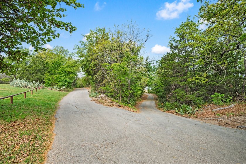 Set beneath a canopy of mature trees, there is an ease to this - photo 40