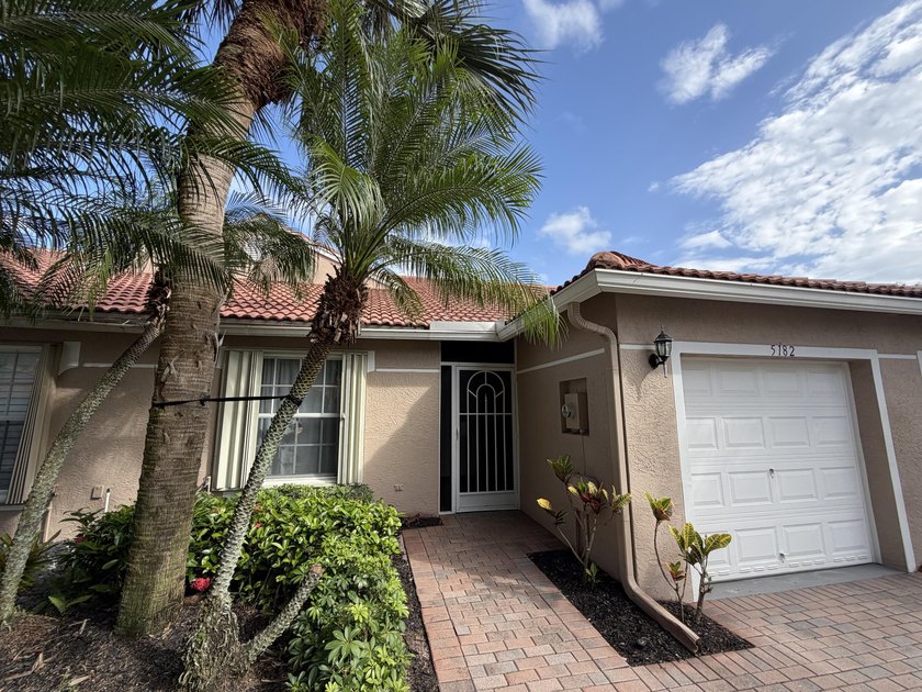 Located in the desirable Tuscany Bay community, this charming - photo 3