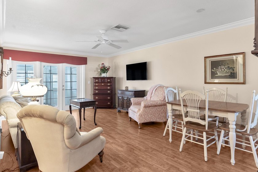 Welcome to this beautifully updated villa, featuring a spacious - photo 4