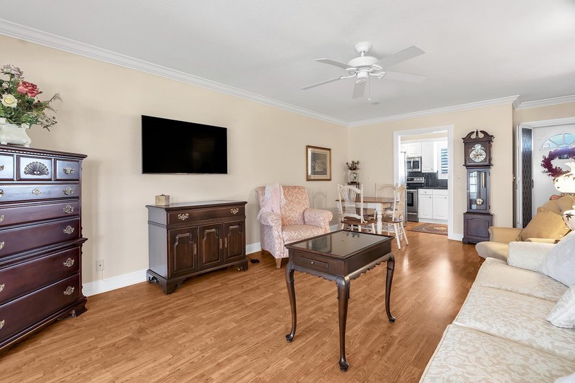 Welcome to this beautifully updated villa, featuring a spacious - photo 8