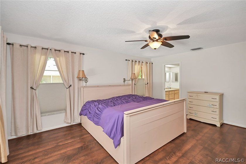 Welcome to this light and bright three-bedroom pool home tucked - photo 17