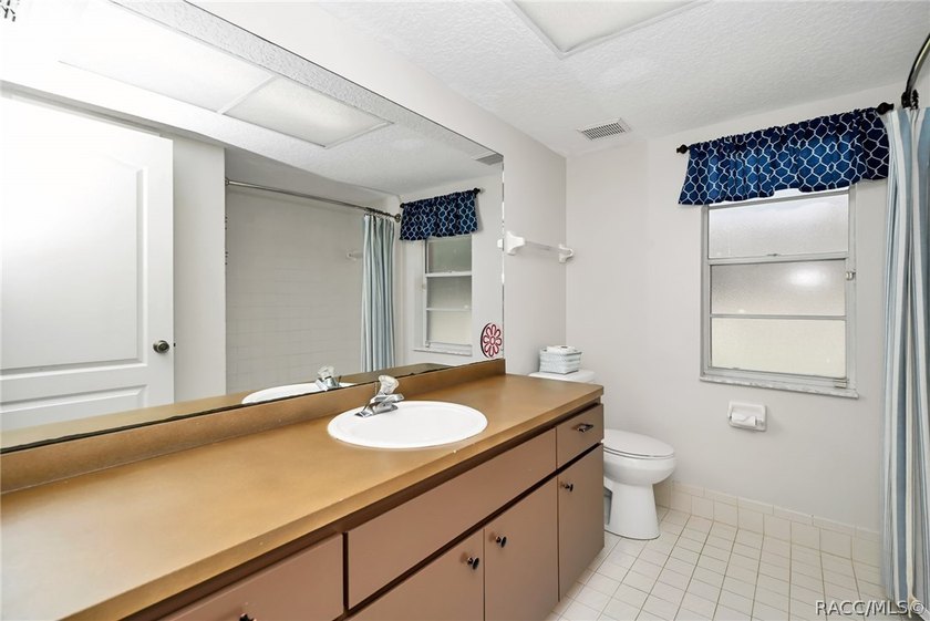 Welcome to this light and bright three-bedroom pool home tucked - photo 24