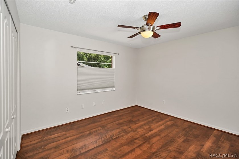 Welcome to this light and bright three-bedroom pool home tucked - photo 27