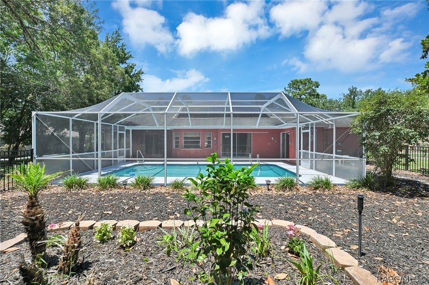Welcome to this light and bright three-bedroom pool home tucked - photo 33