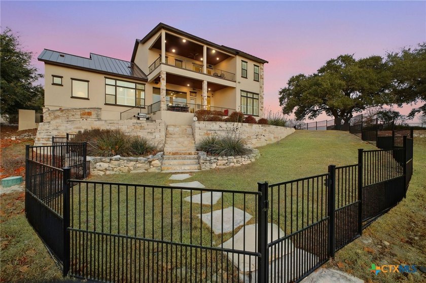 Experience true lakefront living in this stunning custom home - photo 34