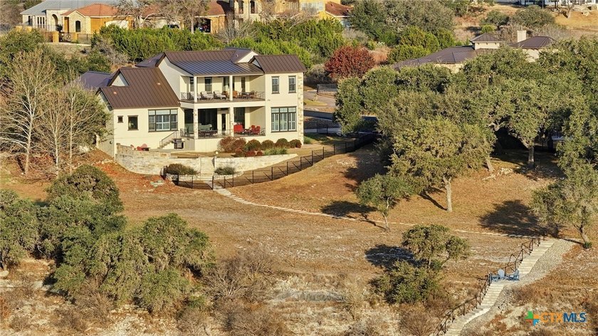 Experience true lakefront living in this stunning custom home - photo 41