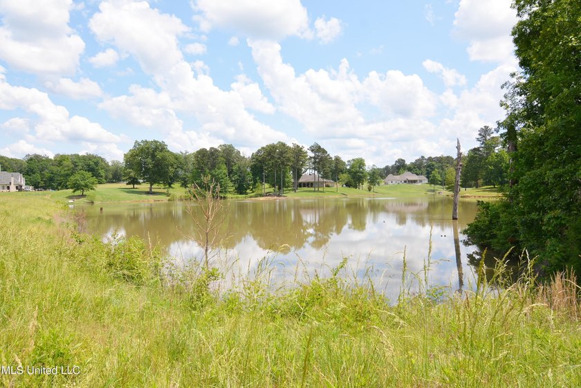 Gorgeous waterfront lot in the upscale, gated subdivision of - photo 3