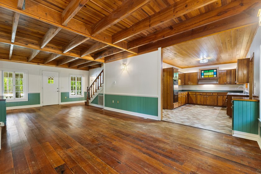 Hidden beneath towering hardwoods on a private wooded setting - photo 10