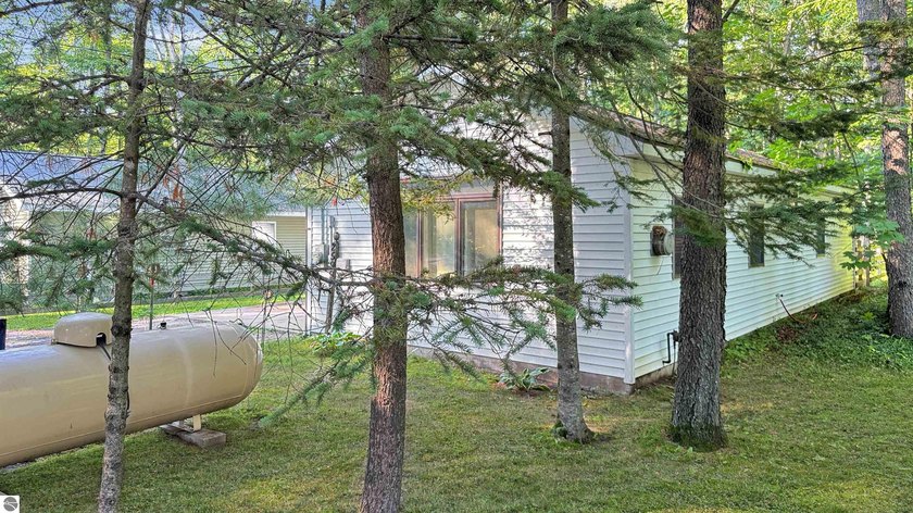 This two-bedroom, one-bath home is located across the street - photo 4