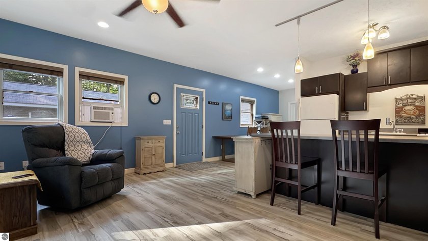 This two-bedroom, one-bath home is located across the street - photo 6