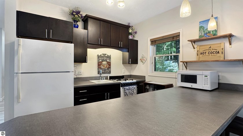 This two-bedroom, one-bath home is located across the street - photo 10