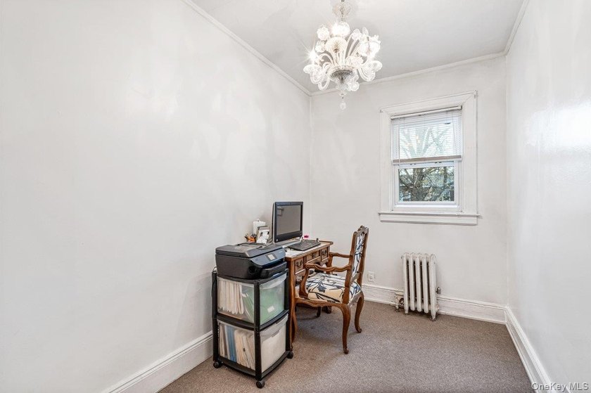 Updated one-family attached brick townhouse nestled in the heart - photo 12