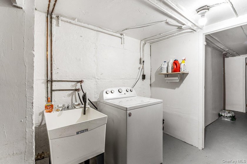 Updated one-family attached brick townhouse nestled in the heart - photo 13