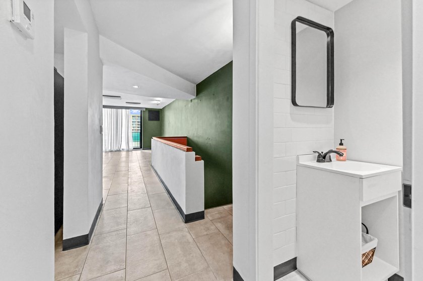 Stylishly updated 2-bedroom, 1.5-bathroom corner unit in the - photo 3