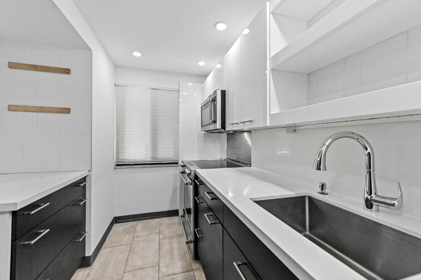 Stylishly updated 2-bedroom, 1.5-bathroom corner unit in the - photo 6