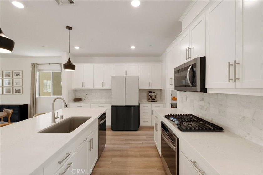 Welcome to this stunning, detached 2022-built home in the highly - photo 8