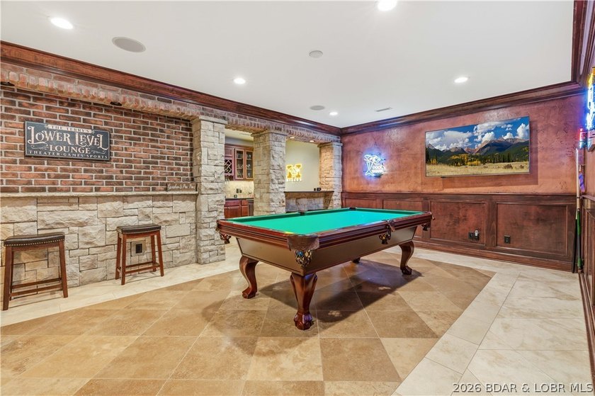 Set on the private waters of Treeline Lake in Four Seasons, this - photo 29