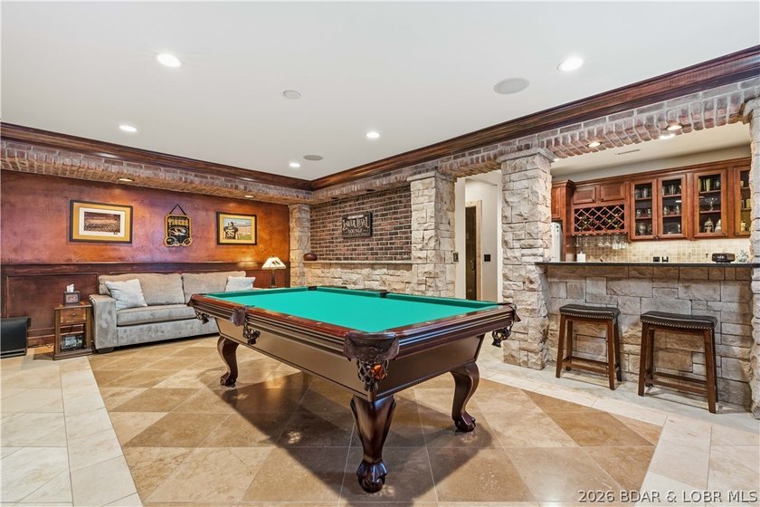 Set on the private waters of Treeline Lake in Four Seasons, this - photo 31