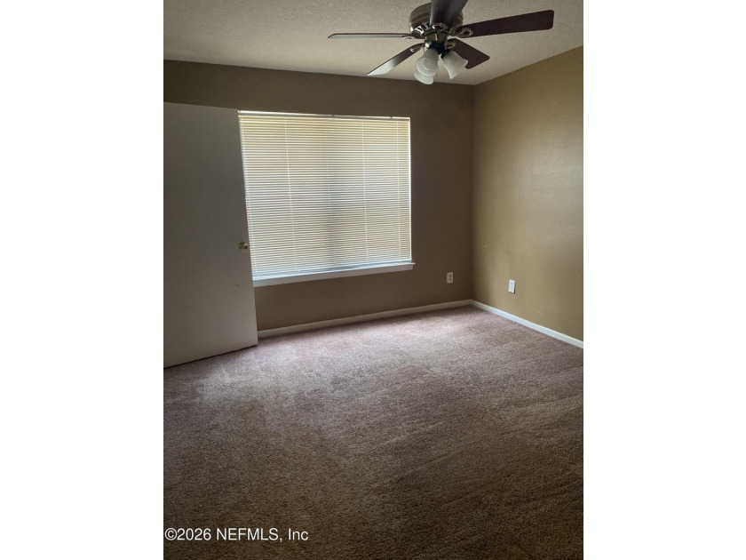 One bedroom, one bathroom condo on first floor. Tile flooring - photo 3
