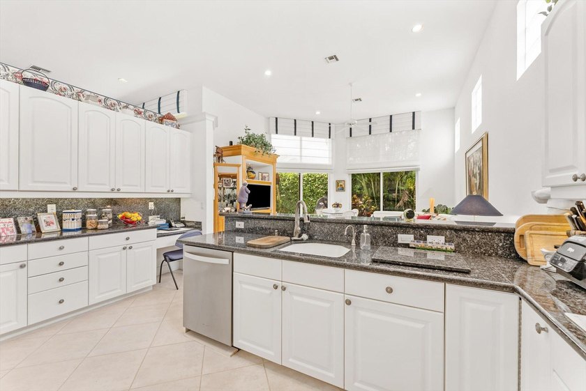 Nestled within the prestigious Woodfield Country Club, this - photo 17