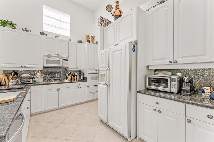 Nestled within the prestigious Woodfield Country Club, this - photo 18