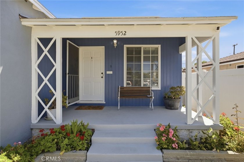 Nestled on a quiet tree lined street in North Long Beach, this - photo 5