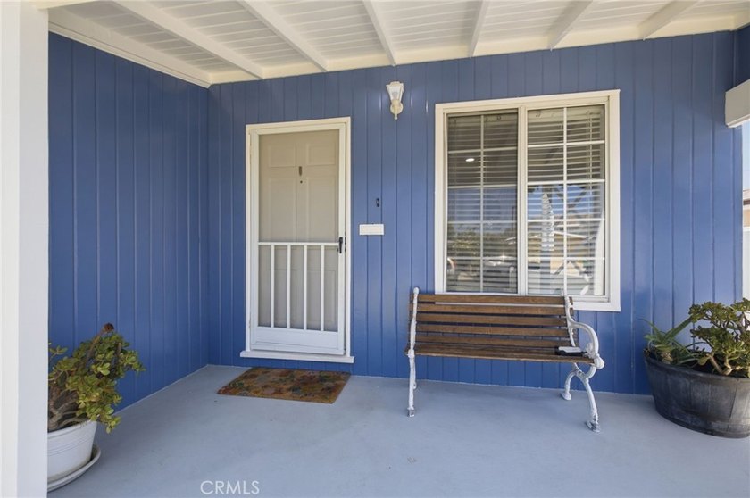 Nestled on a quiet tree lined street in North Long Beach, this - photo 6