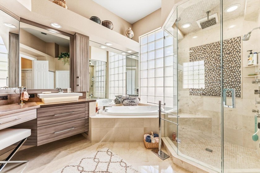Nestled within the prestigious Woodfield Country Club, this - photo 26