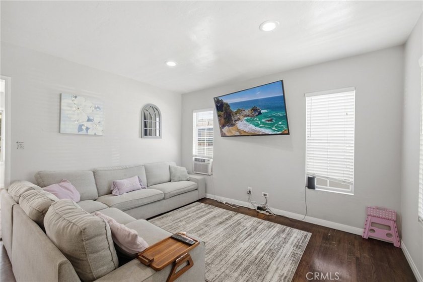 Nestled on a quiet tree lined street in North Long Beach, this - photo 9