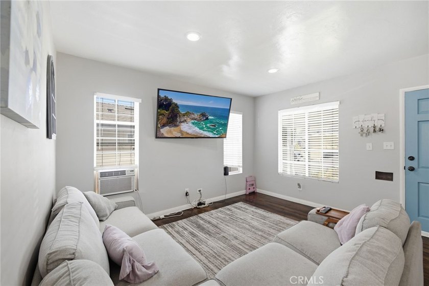 Nestled on a quiet tree lined street in North Long Beach, this - photo 10