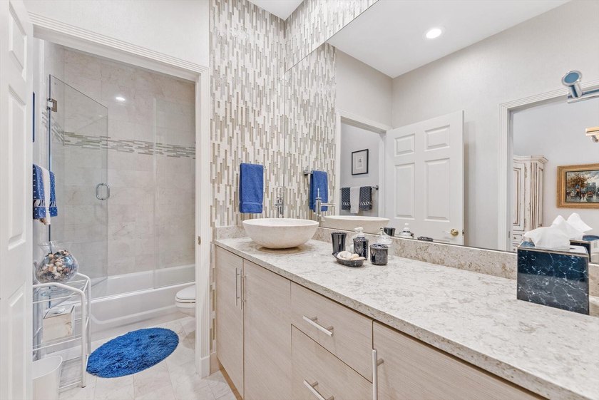 Nestled within the prestigious Woodfield Country Club, this - photo 32