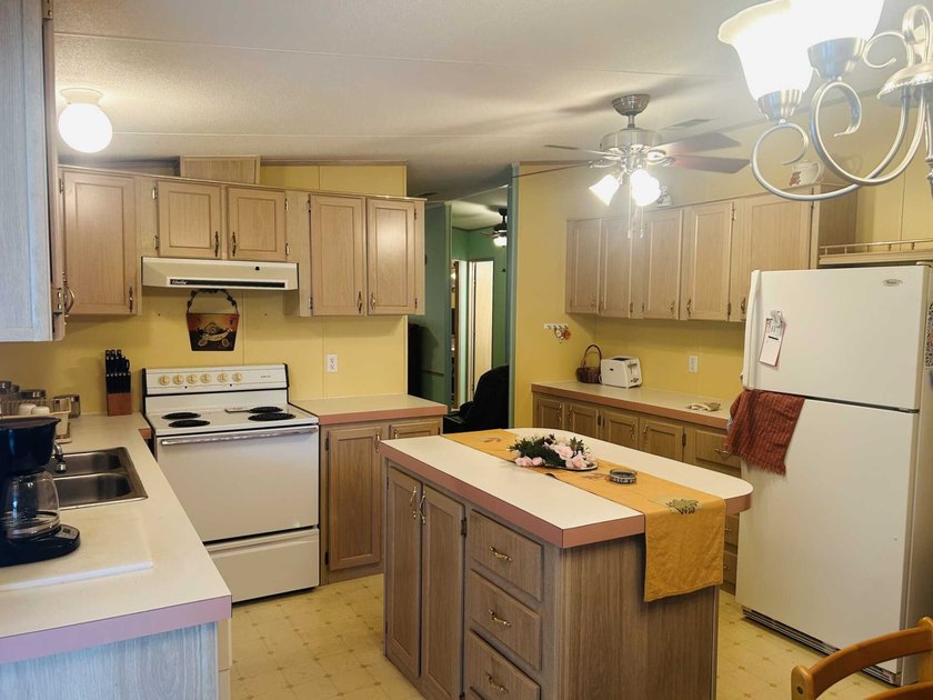 This well-furnished double wide home is perfectly situated on a - photo 9