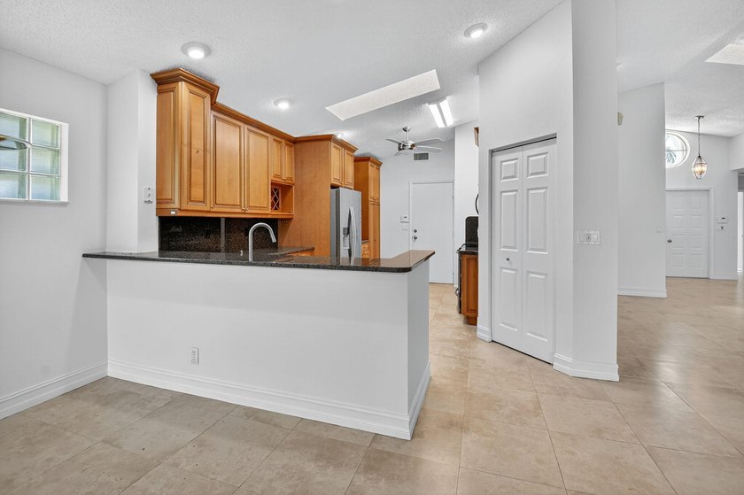 Welcome to this charming single-story residence in Palm Isles - photo 9
