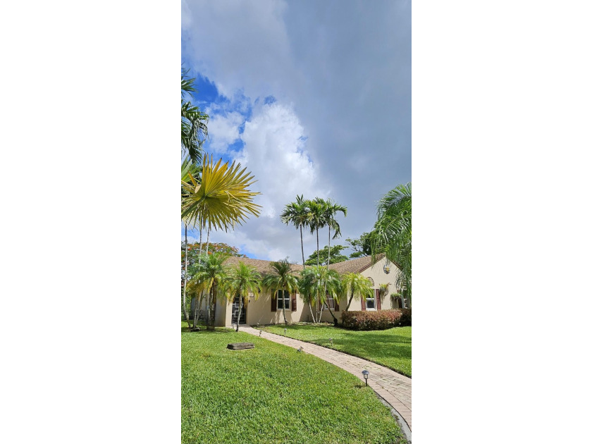 Welcome to this charming two-bedroom, two-bathroom villa in the - photo 3