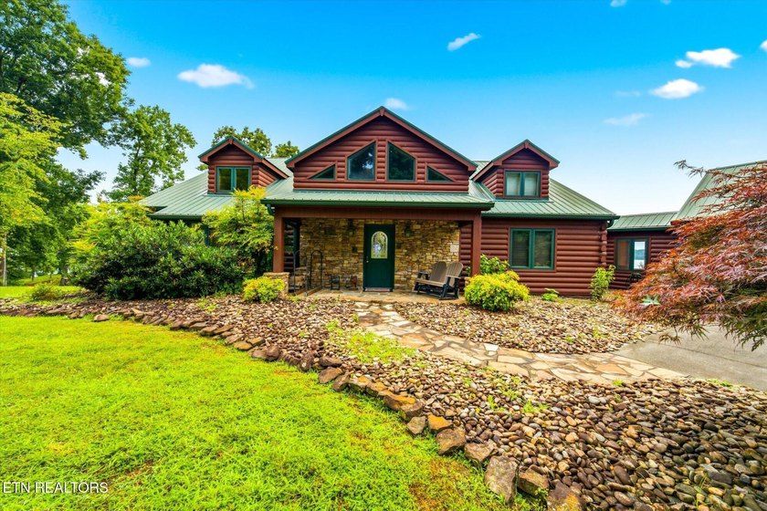 Stunning log home on the main channel of Douglas Lake! This - photo 4
