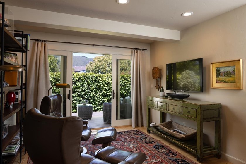 This exquisitely updated townhome enjoys privacy, sunshine, and - photo 12
