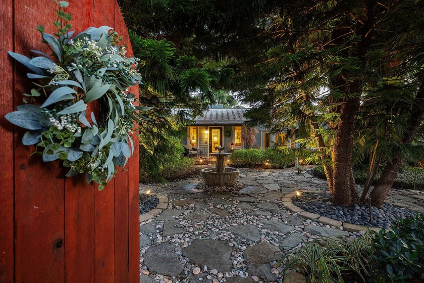 Tucked behind an arched gate on one of Palm Trail's most coveted - photo 3