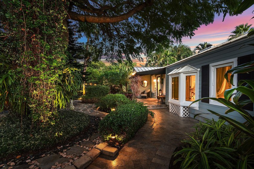 Tucked behind an arched gate on one of Palm Trail's most coveted - photo 4
