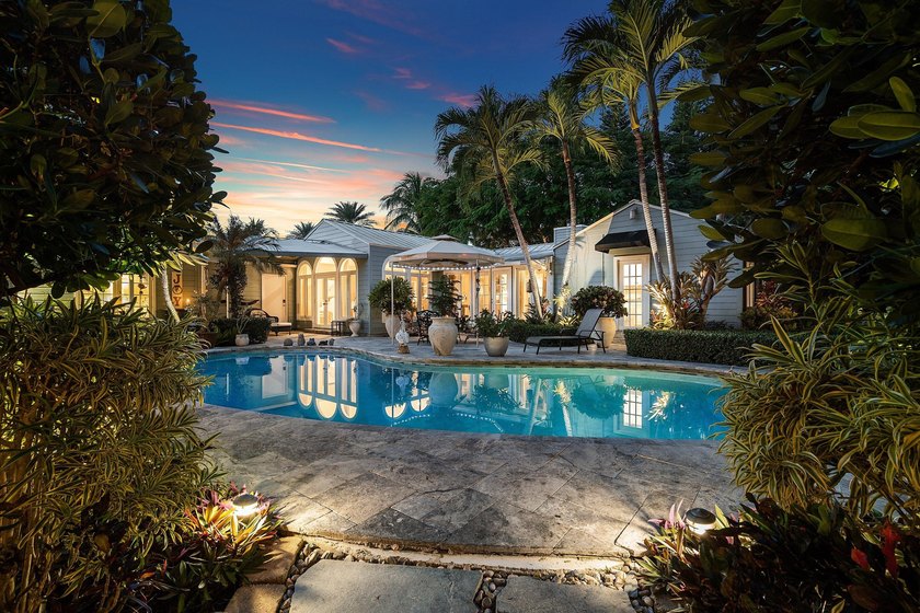 Tucked behind an arched gate on one of Palm Trail's most coveted - photo 6