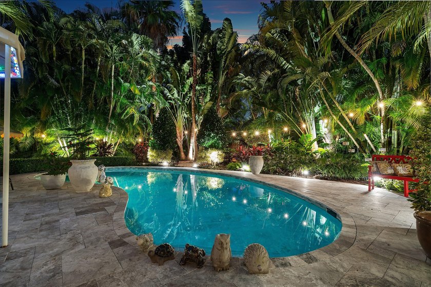 Tucked behind an arched gate on one of Palm Trail's most coveted - photo 8