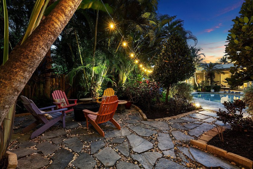 Tucked behind an arched gate on one of Palm Trail's most coveted - photo 10